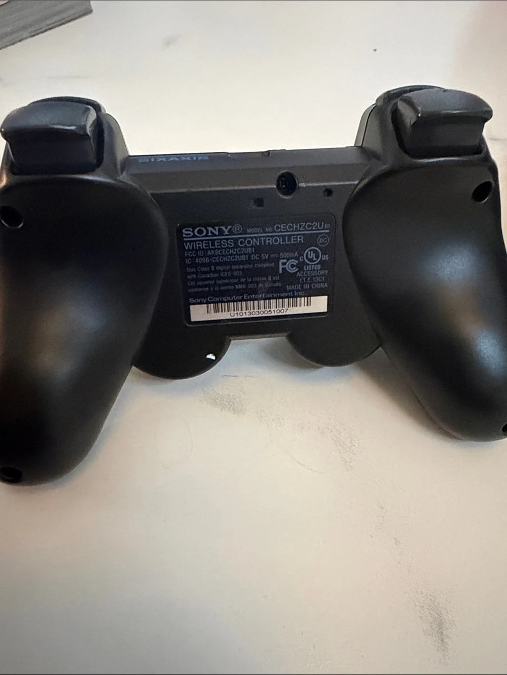 Sony Black Wireless PlayStation Controller with Iconic Button Colors